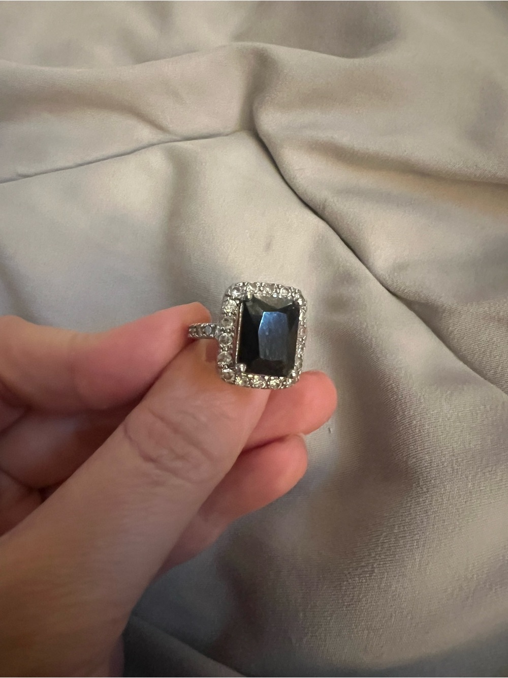 Silver Ring with Black Center Stone and Halo Accents